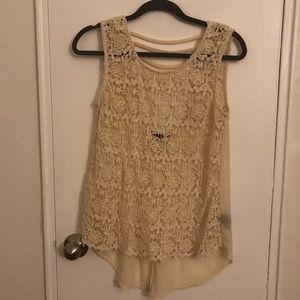 Sleeveless cream blouse